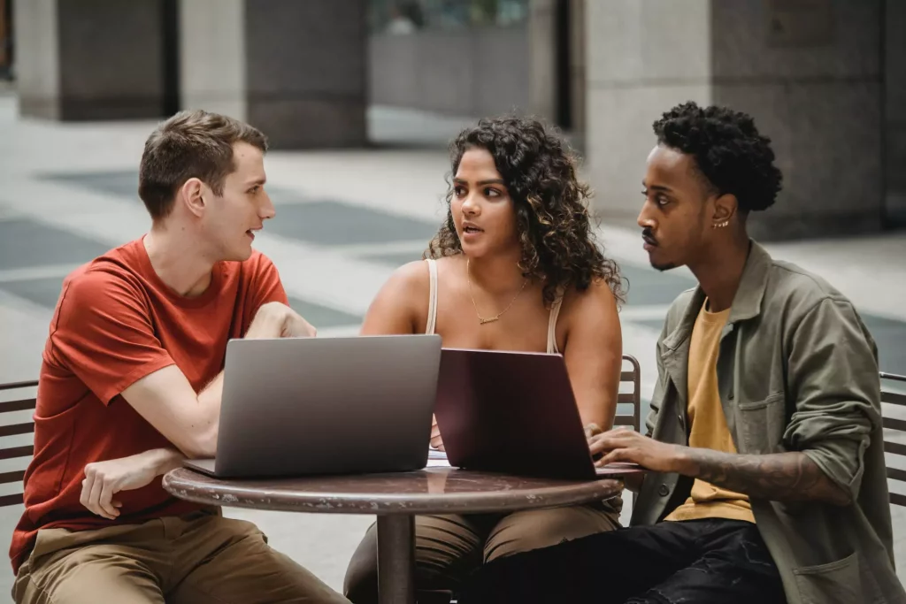 three people discussing