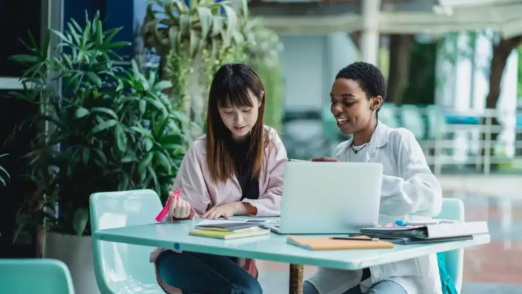 two girls talking about work