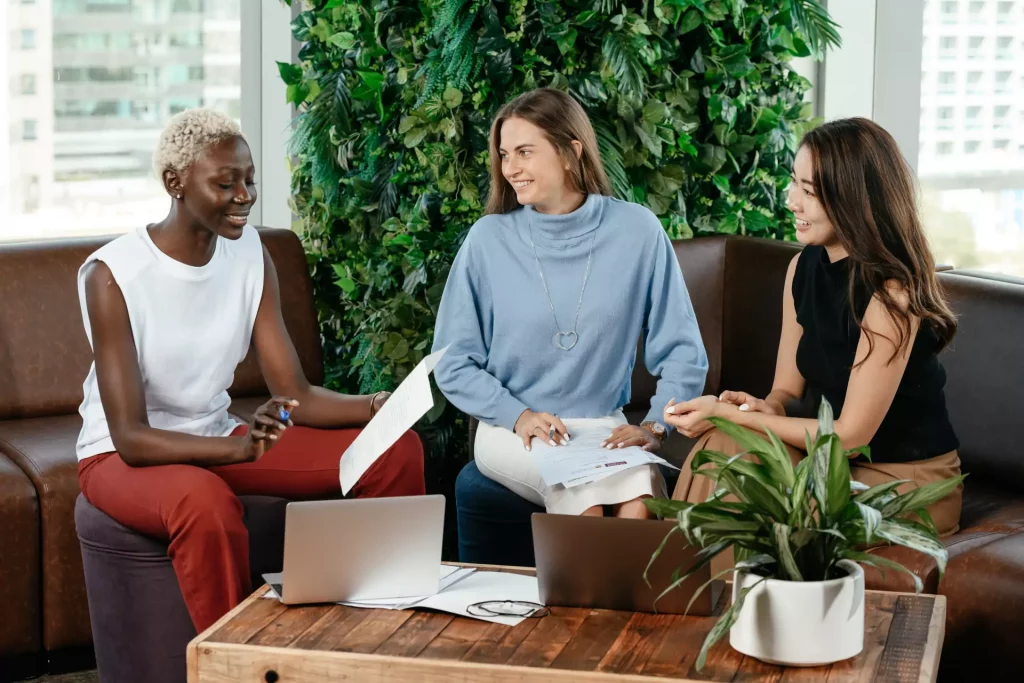 three girls talking about work