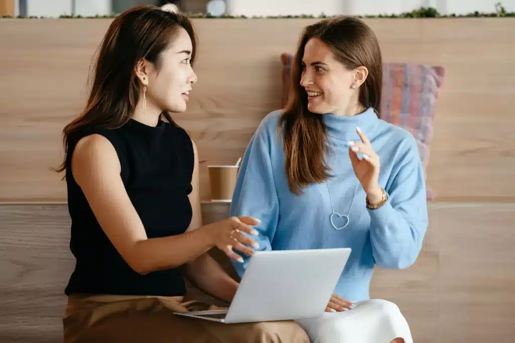 two girls talking about work