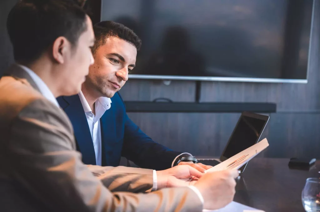 Two people discussing work data